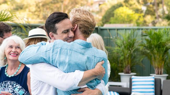 Damien Anthony Rossi and his partner Jason Avery share a moment after a very special proposal at the pair’s home in Brisbane.