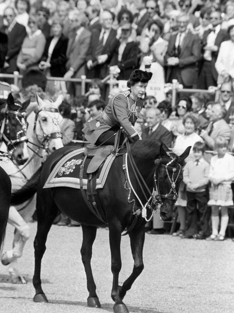 The Queen leans forward to reassure her horse Burmese in The Mall, where a man fired several blanks at her. Picture: Getty Images