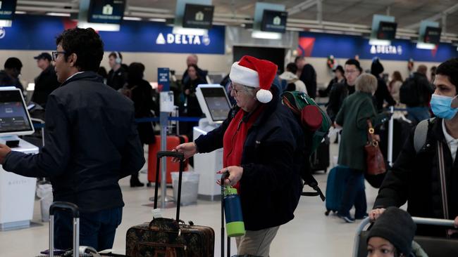 Passengers check in at the Delta counter at Detroit Metro Airport in Romulus, Michigan as forecasters warned of life-threatening weather. Picture: Jess Kowalsky/AFP