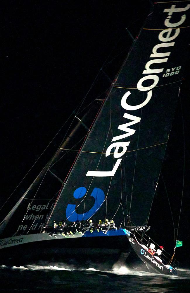 LawConnect raced across the finish line on the Derwent River under the cover of darkness to snare a third line honours win. Picture: AFP