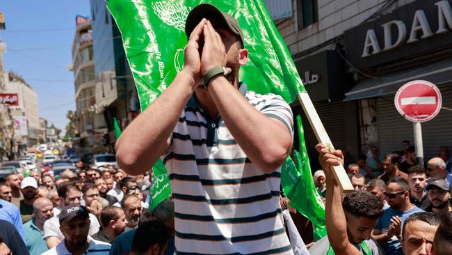 Palestinians protest in the streets of Ramallah in the Israeli-occupied West Bank after the assassination. Picture: Jaafar Ashtiyeh / AFP