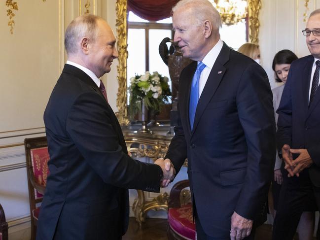 GENEVA, SWITZERLAND - JUNE 16: U.S. President Joe Biden (2L) and Russian President Vladimir Putin shake hands as Swiss President Guy Parmelin (R) looks on during the U.S.-Russia summit at Villa La Grange on June 16, 2021 in Geneva, Switzerland. Biden is meeting his Russian counterpart, Putin, for the first time as president in Geneva, Switzerland. (Photo by Peter Klaunzer - Pool/Keystone via Getty Images)