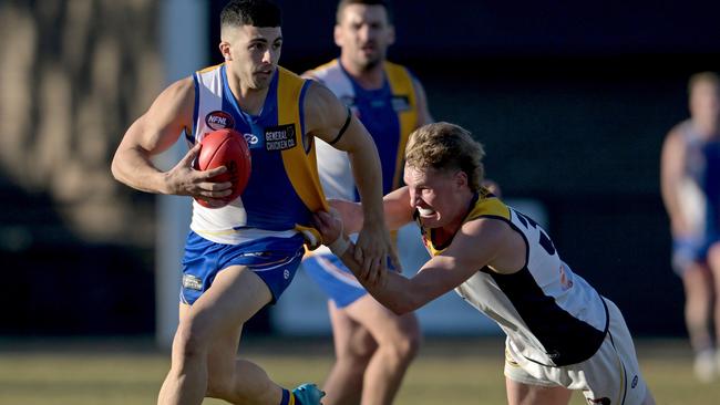 NFNL: Macleod’s James Condello tries to burn off Jack Stewart of Hurstbridge. Picture: Andy Brownbill