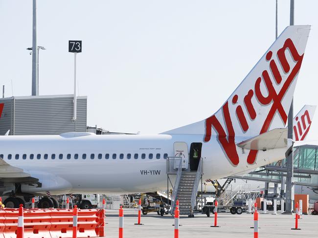 DO NOT USE, EMBARGO, HOLD COURIER MAIL FUTURE TOURISM CAMPAIGN A Virgin Australia plane at the International Terminal of Brisbane Airport on Friday, August 30, 2019. (AAP Image/Claudia Baxter)