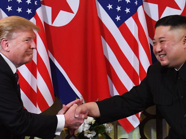 (FILES) In this file photo taken on February 27, 2019 US President Donald Trump (L) speaks with North Korea's leader Kim Jong Un during a meeting at the Sofitel Legend Metropole hotel in Hanoi. - President Donald Trump on March 22, 2019, abruptly announced the cancellation of sanctions imposed by his own Treasury Department to tighten international pressure on North Korea. "It was announced today by the U.S. Treasury that additional large scale Sanctions would be added to those already existing Sanctions on North Korea. I have today ordered the withdrawal of those additional Sanctions!" Trump said in a tweet. He appeared to be referring to measures unveiled Thursday that targeted two Chinese companies accused of helping North Korea to evade tight international sanctions meant to pressure Pyongyang into ending its nuclear weapons program. But The Washington Post reported, citing Trump administration officials, that the president's tweet referenced future sanctions that had not been announced and were scheduled for "the coming days." (Photo by Saul LOEB / AFP)