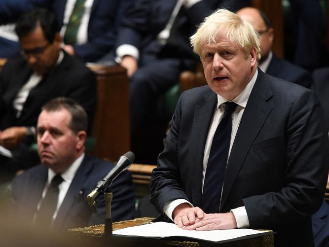 Boris Johnson speaks to members of parliament as they hear tributes in memory of their killed colleague David Amess. Picture: AFP