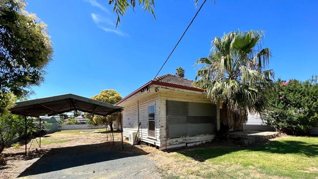 A home on Mackay Street, Rochester for sale, following flood.