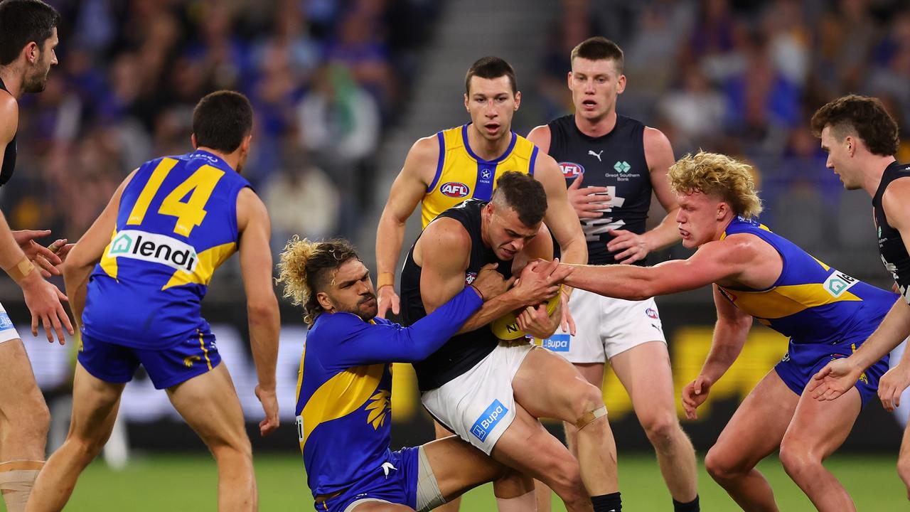 PERTH, AUSTRALIA – APRIL 29: Sam Petrevski-Seton of the Eagles tackles Alex Cincotta of the Blues during the round seven AFL match between the West Coast Eagles and Carlton Blues at Optus Stadium, on April 29, 2023, in Perth, Australia. (Photo by Paul Kane/Getty Images)