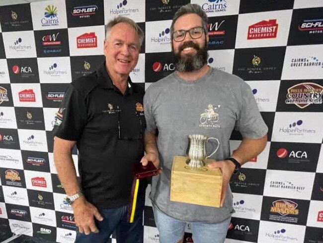 CQ Seamers' skipper Joe McGahan (right) receives the Dirk Tazelaar Medal for player of the tournament from the man himself.