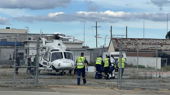 The motorcycle driver – a 58-year-old man is being taken on the rescue helicopter to Canberra Hospital. Picture: Niki Iliagoueva