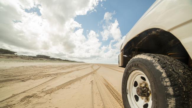 4WD BEACH STOCK -  Fraser Island, Australia - April 20, 2016: Low angle view of a 4x4 on sand on Fraser Island. Picture: Istock