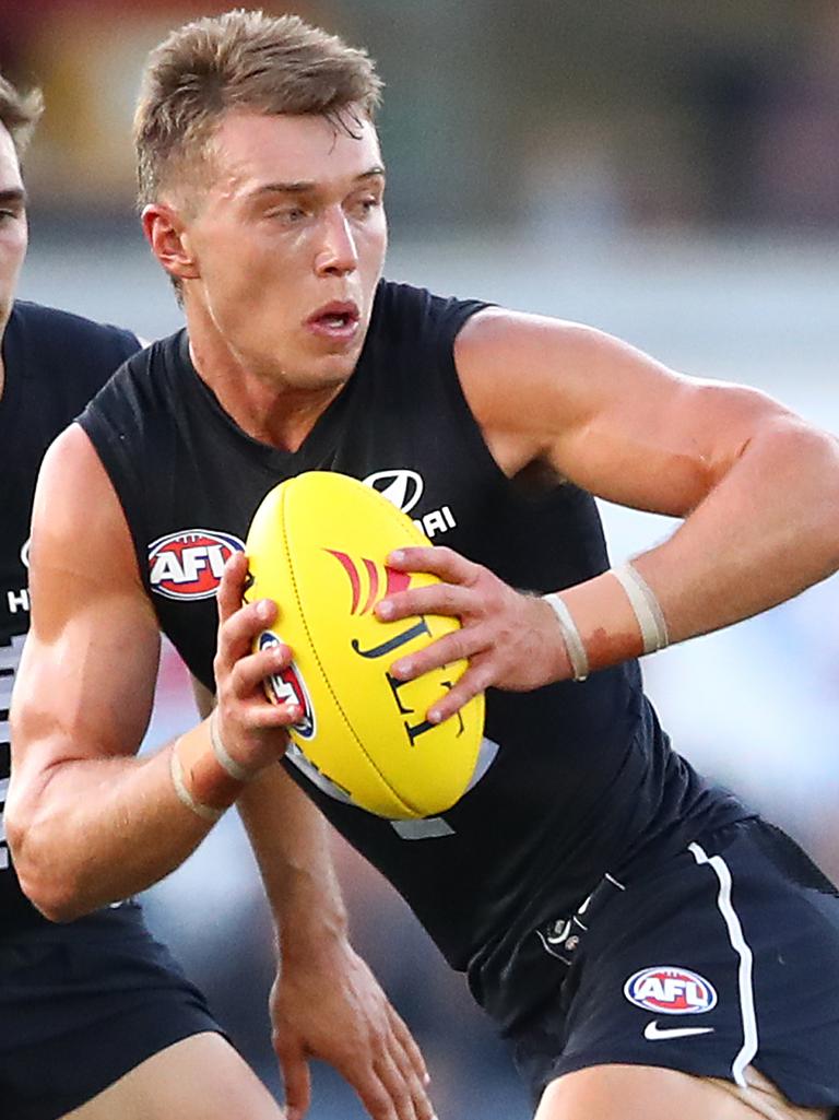 Carlton’s Patrick Cripps  runs with the ball against the Essendon Bombers at Ikon Park. Picture: Scott Barbour/Getty