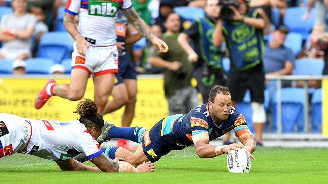 Tyrone Roberts of the Titans scores a try during the Round 6 NRL match against the Knights at Cbus Super Stadium. Picture: Getty Images