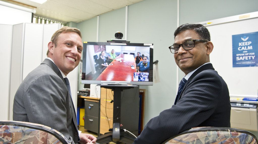 Queensland Health Minister Steven Miles (left) and consultant nephrologist Dr Sree Krishna Venuthurupalli demonstrate the telehealth technology used by the specialist renal team to deliver services to Cherbourg, Friday, April 27, 2018. Picture: Kevin Farmer