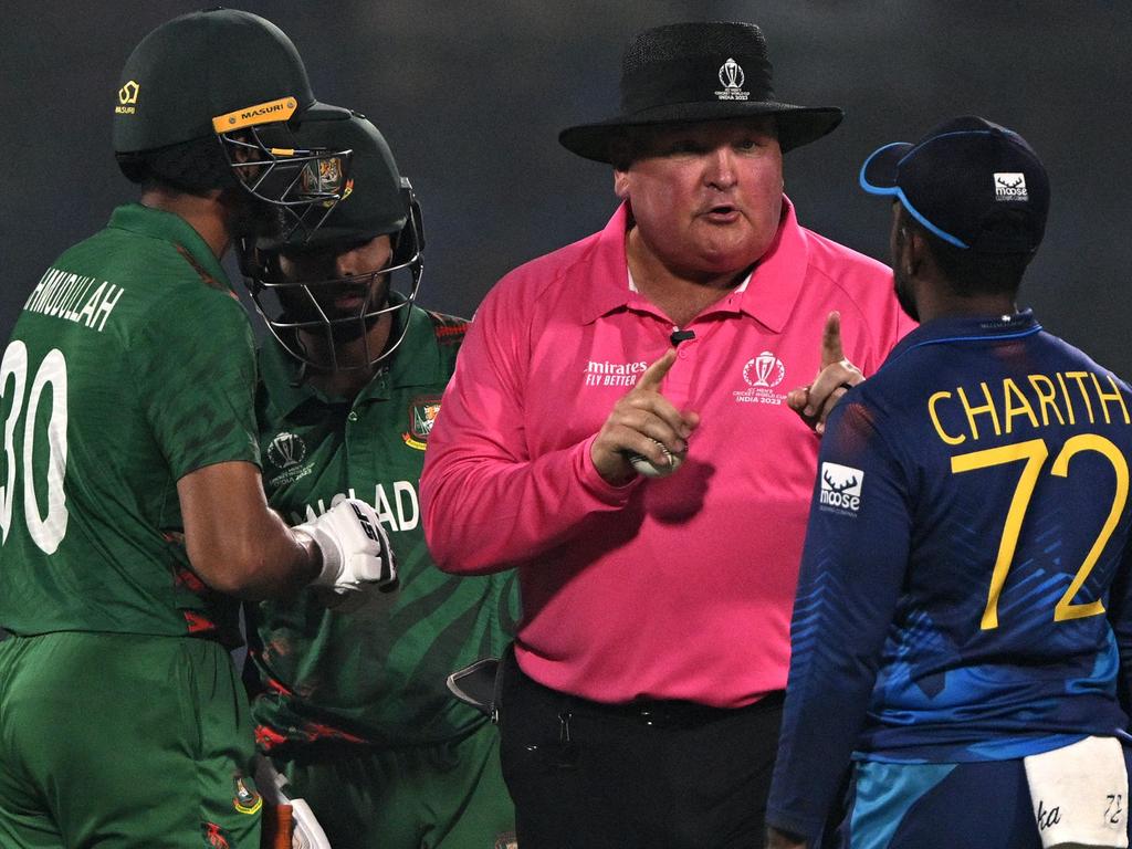 Umpire Marais Erasmus lays down the law to Sri Lanka's Charith Asalanka (R) during the match against Bangladesh. Picture: AFP