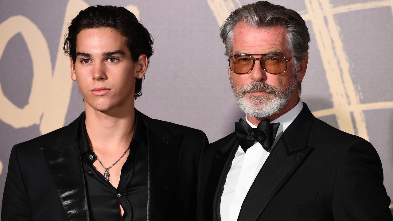 Pierce’s youngest Paris Brosnan with his dad at a fashion event in London. Picture: Getty.