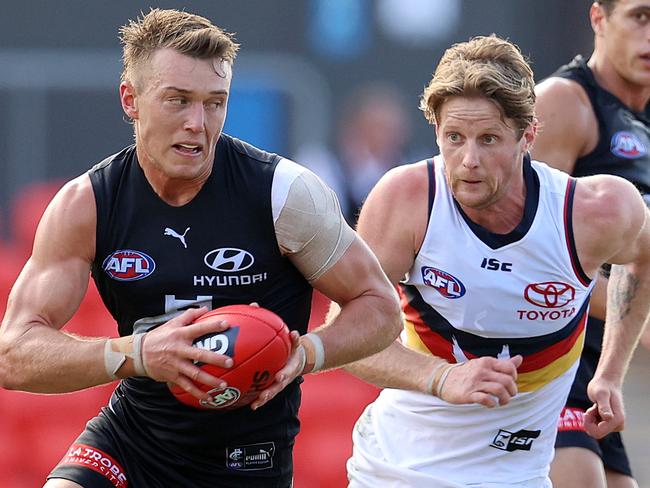 AFL Round 17. 13/09/2020. Carlton vs Adelaide at Metricon Stadium, Gold Coast..   Patrick Cripps of the Blues out of the centre infront of  Rory Sloane of the Crows      . Pic: Michael Klein