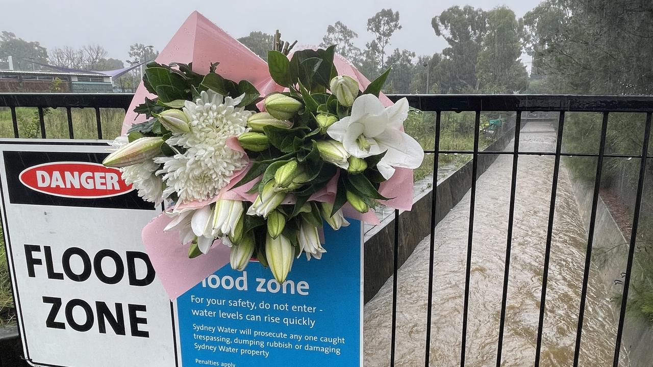 Floral tributes were left at the canal about a kilometre from where the bodies of a man and woman were found.