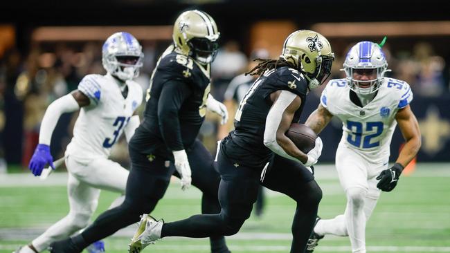 Alvin Kamara #41 of the New Orleans Saints runs with the ball in the fourth quarter against the Detroit Lions. Chris Graythen/Getty Images/AFP