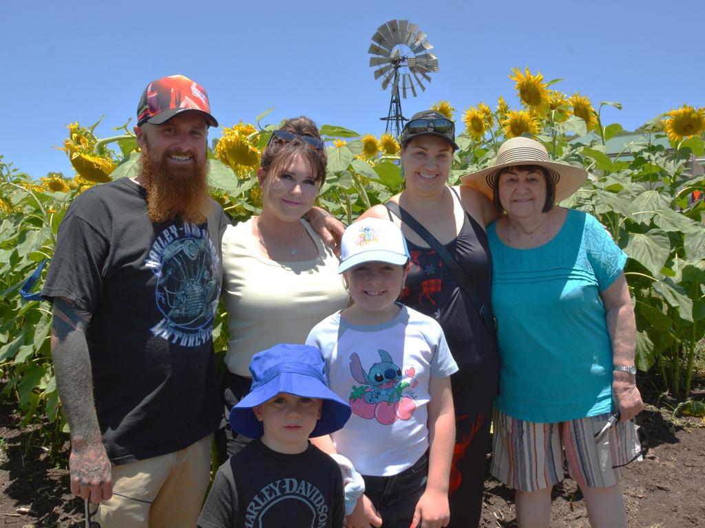 Lilyvale Flower Farm's impressive sunflower crop saw dozens flock to the sunny fields, including (from left) Dan, Kirstie, Heidi, Dorothy, Sonny and Mackenzie on Sunday, December 22, 2024. Photo: Jessica Klein