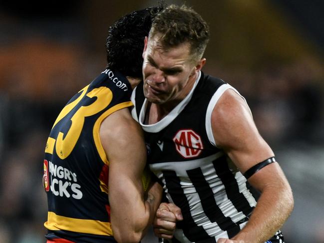 ADELAIDE, AUSTRALIA - AUGUST 17:   Izak Rankine of the Crows is knocked out by  a late hit from  Dan Houston of the Power during the round 23 AFL match between Port Adelaide Power and Adelaide Crows at Adelaide Oval, on August 17, 2024, in Adelaide, Australia. (Photo by Mark Brake/Getty Images)