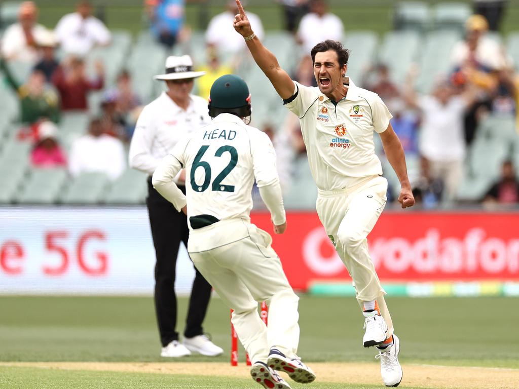 Mitchell Starc of Australia celebrates after taking the wicket of Prithvi Shaw of India.