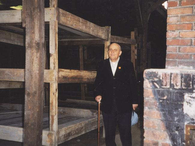 Dr Tony Bernard beside his bunk in Auschwitz.