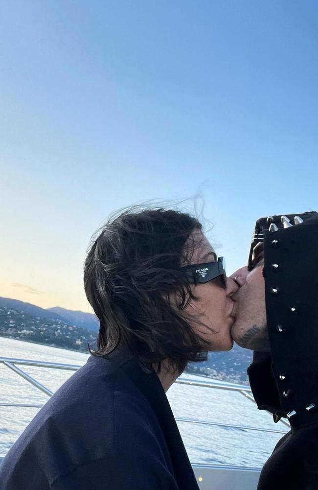 Barker uploaded this photo of the couple bundled up for a smooch. Picture: Instagram