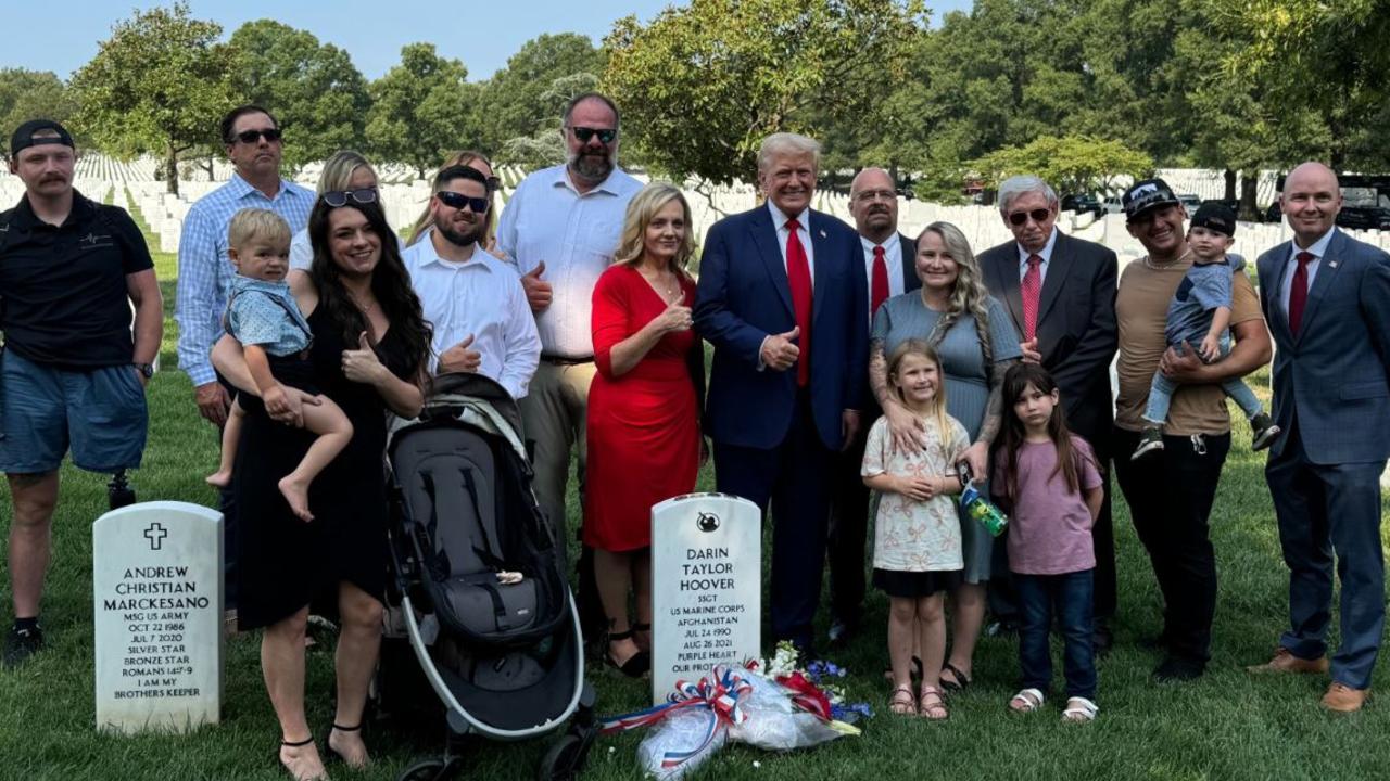 Mr Trump has been criticised for posing with families next to their relatives’ gravestones – in this case, while smiling and flashing the thumbs up sign. Picture: X