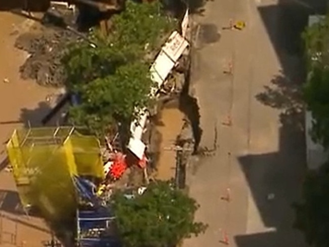 Bitumen and scaffolding fell into the waterlogged pit. Picture: Channel 7.
