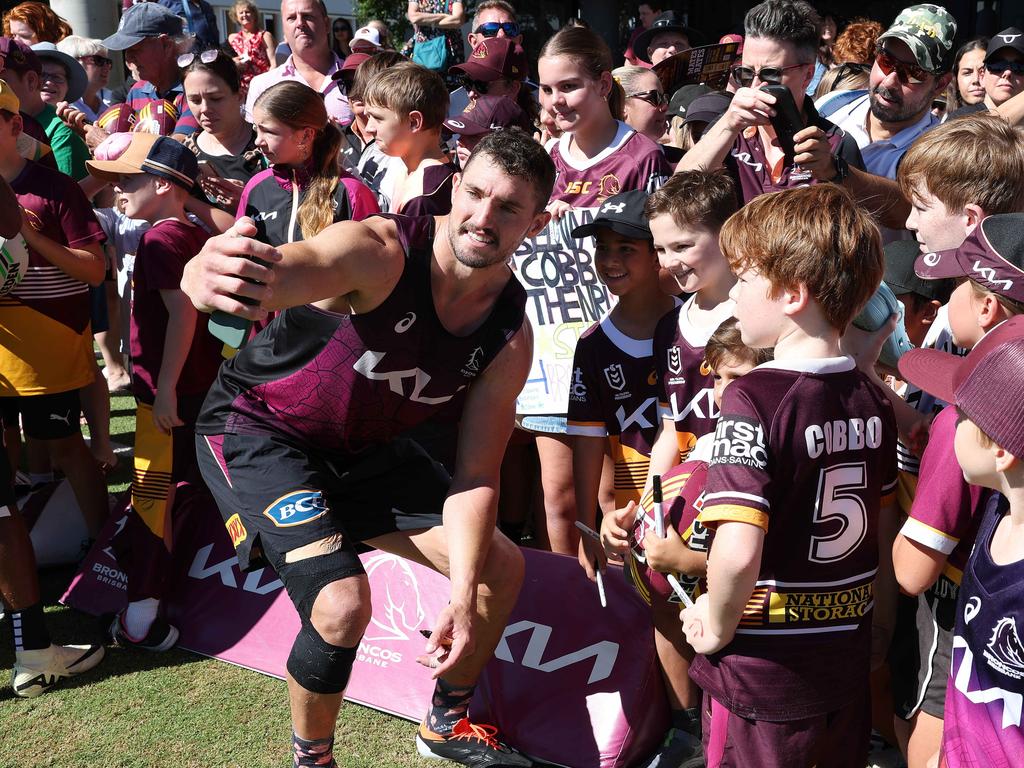 Fan favourite Corey Oates taking selfies with fans after Brisbane Broncos training. Picture: Liam Kidston