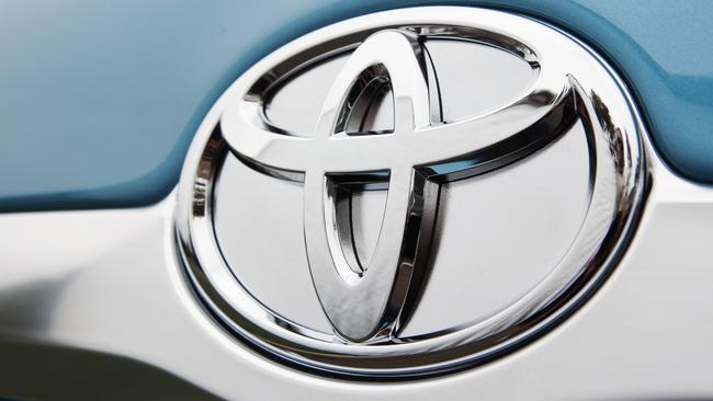 Badge on the 2010 Toyota Camry Hybrid Luxury sedan.