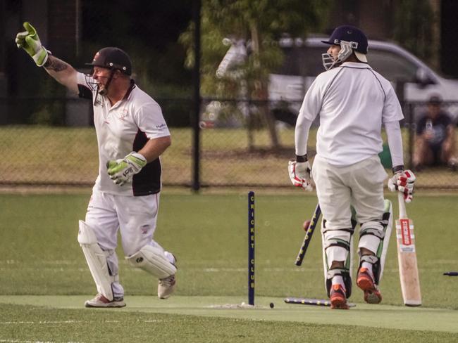 How’s that? Cardinia keeper Luke Turner and Cranbourne Meadows batter Gurpreet Bhmra. Picture: Valeriu Campan