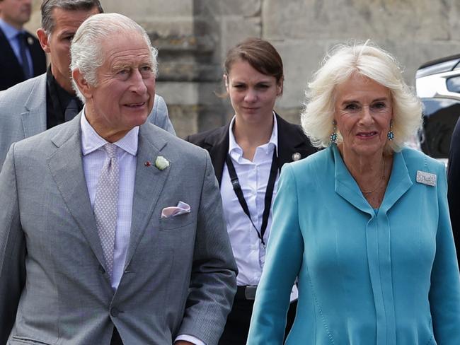 Britain's Queen Camilla (R) and King Charles III (L) arrive at The Bordeaux's Hotel de Ville (city hall) in Bordeaux, southwestern France, on September 22, 2023. Britain's King Charles III and his wife Queen Camilla are on a three-day state visit starting on September 20, 2023, to Paris and Bordeaux, six months after rioting and strikes forced the last-minute postponement of his first state visit as king. (Photo by Thibaud MORITZ / POOL / AFP)