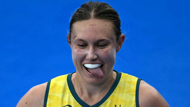 Australia's midfielder #21 Renee Taylor celebrates scoring her team's first goal in the women's pool B field hockey match between Australia and the USA during the Paris 2024 Olympic Games at the Yves-du-Manoir Stadium in Colombes on July 31, 2024. (Photo by Mauro PIMENTEL / AFP)