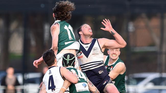 Tom Brindley and Hamish Shepheard battle in the ruck. Picture: Steve Tanner