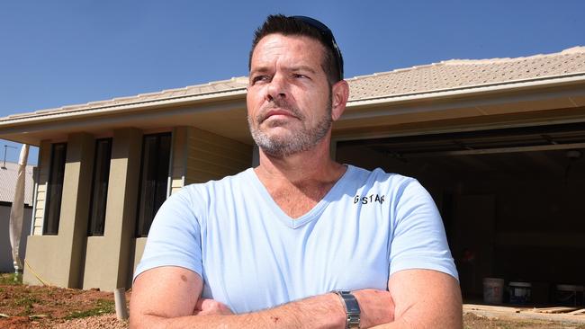 Rod Mattingley with his botched Q1 Homes house which is now being completed by related company Empire Constructions Pty Ltd. Photo: John Gass