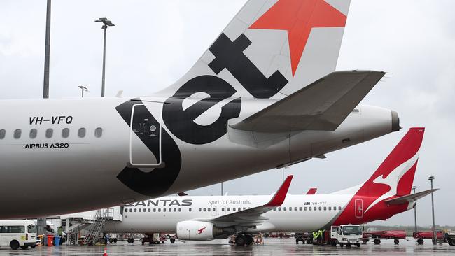 A Jetstar Airbus A320 and Qantas Boeing 737-800 jet aircraft at Cairns Airport. Picture: Brendan Radke