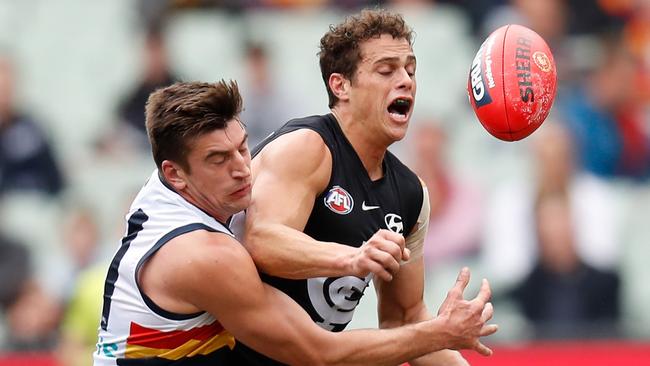 Patrick Wilson lays a solid tackle on Carlton’s Ed Curnow. Picture: Michael Willson/AFL Photos via Getty Images