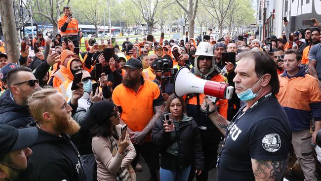 John Setka attempts to speak with construction workers at the CFMEU office. Picture: David Crosling