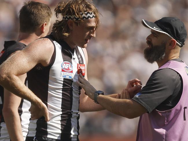 MELBOURNE, AUSTRALIA - SEPTEMBER 30: Nathan Murphy of the Magpies leaves the field with trainers during the 2023 AFL Grand Final match between Collingwood Magpies and Brisbane Lions at Melbourne Cricket Ground, on September 30, 2023, in Melbourne, Australia. (Photo by Daniel Pockett/AFL Photos/via Getty Images)