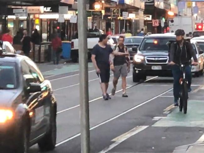 The two men fought in front of peak-hour Chapel St traffic. Picture: Supplied