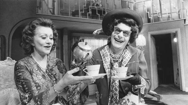 British actress Joan Plowright having tea with Australian housewife superstar Dame Edna Everage, at the Lyric Theatre in London, 1976.