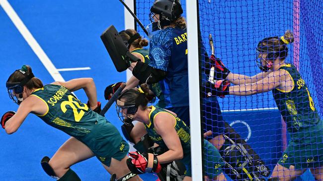 Australia's players defend a penalty corner in the women's pool B field hockey match between Argentina and Australia during the Paris 2024 Olympic Games at the Yves-du-Manoir Stadium in Colombes on August 1, 2024. (Photo by Miguel MEDINA / AFP)