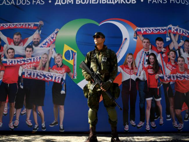 A Brazilian soldier stands guard outside the Olympic Russian house.