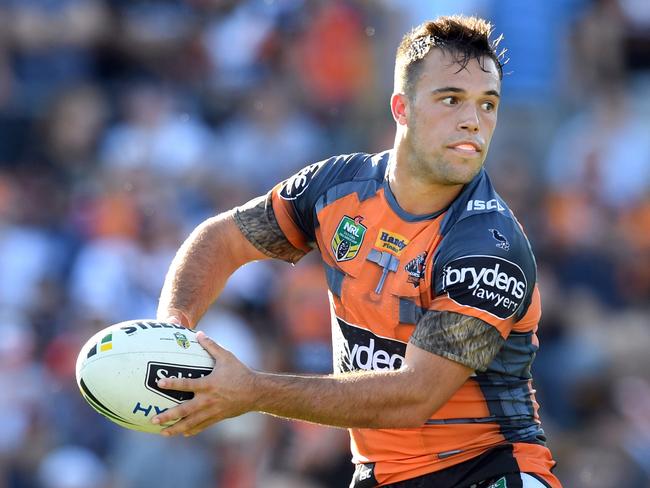 Luke Brooks looks to pass the ball against the Melbourne Storm.