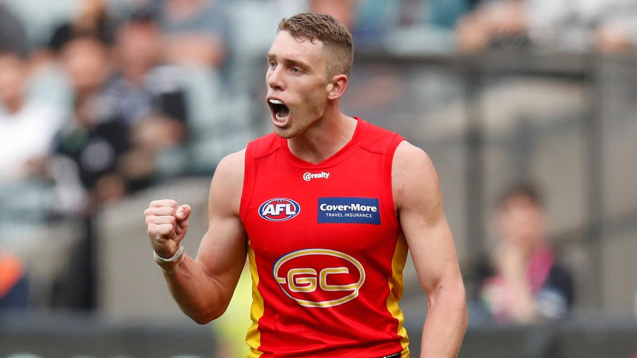 MELBOURNE, AUSTRALIA - MAY 01: Josh Corbett of the Suns celebrates a goal during the 2021 AFL Round 07 match between the Collingwood Magpies and the Gold Coast Suns at the Melbourne Cricket Ground on May 01, 2021 in Melbourne, Australia. (Photo by Michael Willson/AFL Photos via Getty Images)