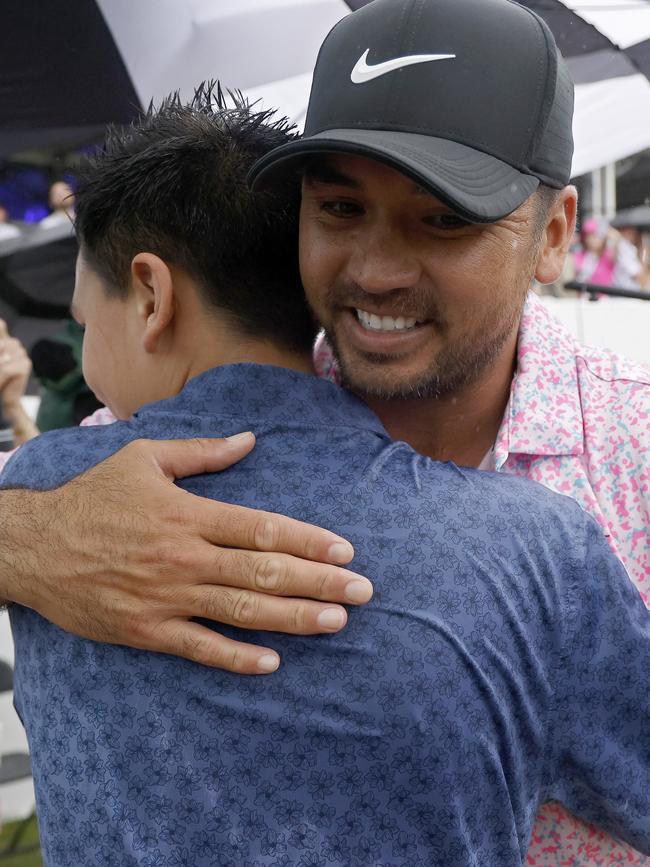 Jason Day embraces his oldest child, son Dash. Picture: Getty Images