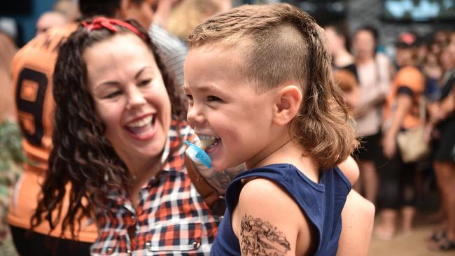 A child sports a mullet haircut at Mulletfest 2018 in the town of Kurri Kurri, 150 kms north of Sydney on February 24, 2018. Mulletfest is a celebration of the iconic haircut called the mullet which began in the 1970s and popular in the 1980s, and making a comeback in Australia. / AFP PHOTO / PETER PARKS