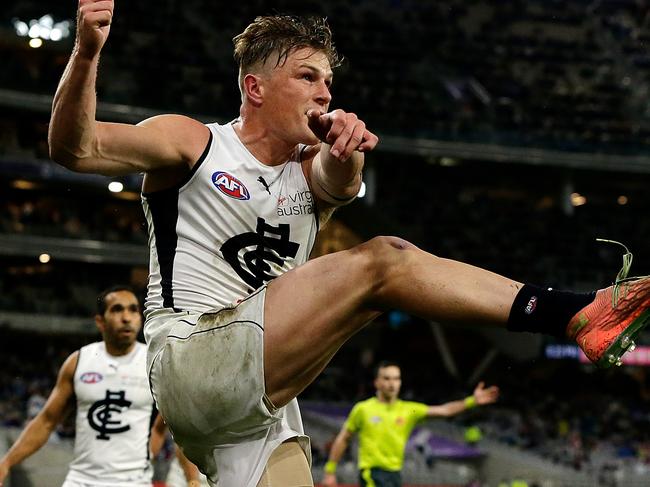 PERTH, AUSTRALIA - AUGUST 15: The Blues celebrate after Jack Newnes scores a goal after the siren to win the match during the 2020 AFL Round 12 match between the Fremantle Dockers and the Carlton Blues at Optus Stadium on August 15, 2020 in Perth, Australia. (Photo by Will Russell/AFL Photos via Getty Images)